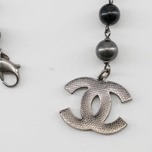 Load image into Gallery viewer, Chanel Black and Silver CC bead bracelet and single earring