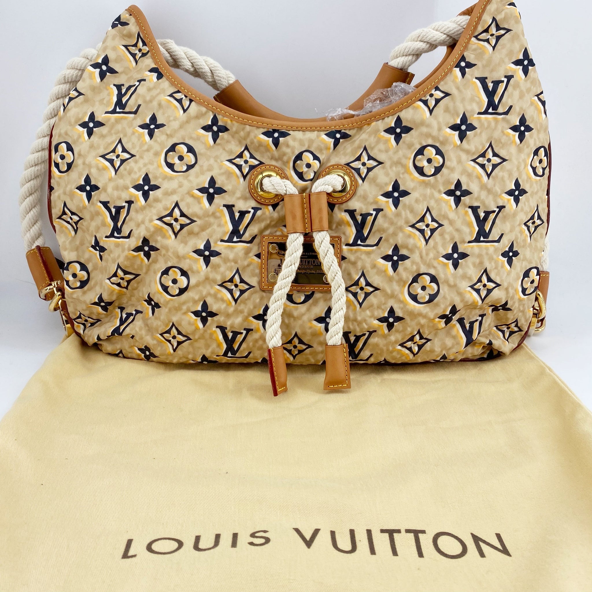 Louis Vuitton Limited Edition Tan Nylon Monogram Bulles PM Bag - Yoogi's  Closet