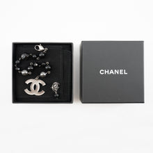 Load image into Gallery viewer, Chanel Black and Silver CC bead bracelet and single earring
