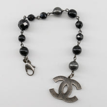 Load image into Gallery viewer, Chanel Black and Silver CC bead bracelet and single earring
